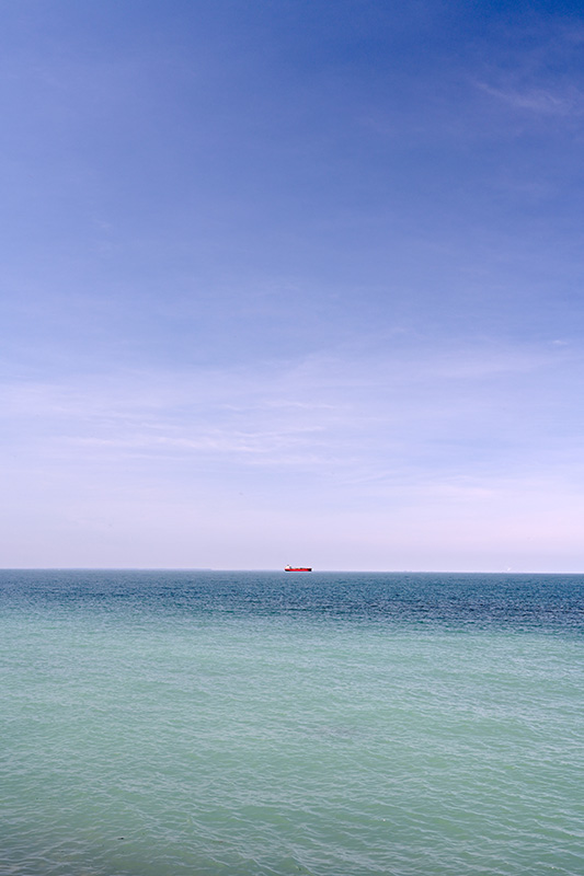 Red ship on the horizon